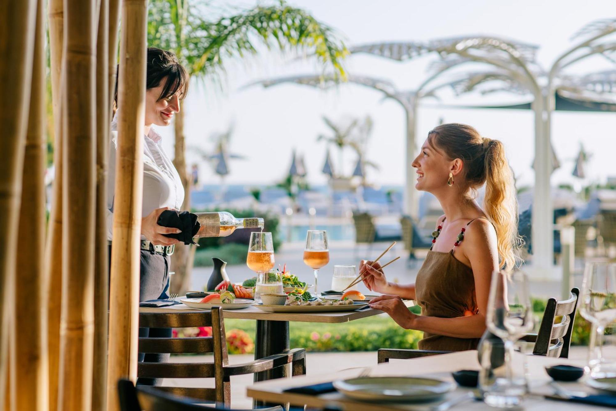 Ivi Mare - Designed For Adults By Louis Hotels Geroskipou Екстериор снимка A waitress serving a guest at a restaurant